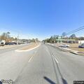 Truck hauling cars runs red light on US-301
