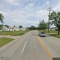 Police manage traffic around deer in roadway