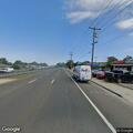 Dark sedan stopped on Sunrise Highway shoulder