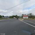 Woman walking in middle of road on Marlin