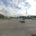 Semi truck with smoking brakes in commercial area