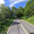 Speeding vehicles endanger road worker on River Road