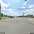 Woman screaming at traffic near railroad tracks