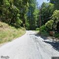 Group of vehicles racing on Pescadero Creek Road