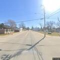 Person driving fast then walking near hilltop church