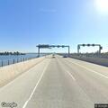 Pedestrian walking on SR-520 shoulder