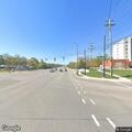 Male crawling in street near Hilton hotel