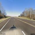 Officers check unoccupied gray Honda on Highway 64