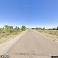 Blue Nissan partially blocking Dike Road