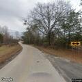 Large tree blocks Main Street at Highway 97