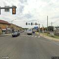 Person hanging out of pickup truck on Avon Road
