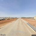 Car driving on blown tires leaves debris on roadway