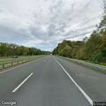 Elderly man with cane outside vehicle on Route 90