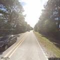 Tree blocking road near Highway 11 and Industrial Parkway