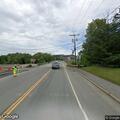 Vehicle nearly hits officer’s mirror on Main Street