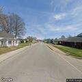 Traffic stop on silver Nissan near school