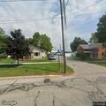 Man with breathing difficulty at street intersection
