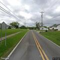 Tree branch partially blocking roadway