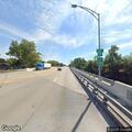Small dog running across Route 20 near Water Street