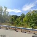 Officer contacts man walking near Forest Park bridge