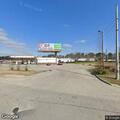 Man with sticks threatening people at strip mall