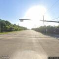 Disabled trash truck blocking roadway