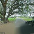 Officer checking report of woman walking on road