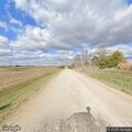 Vehicle goes into ditch north of rural residence