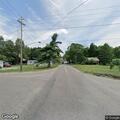 Tree branch causing traffic hazard at intersection