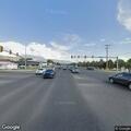 Traffic stop on small dark sedan near Motel 6