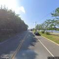 Intoxicated man stumbling on bicycle at yacht club