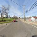Woman driving maroon Toyota Camry slowly near county line
