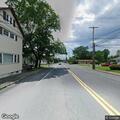Dead deer creating roadway hazard on sidewalk
