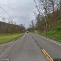 Woman walking in roadway causing traffic hazard