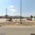 Officer assists driver with rental car in parking lot