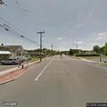 Person in wheelchair traveling in wrong lane