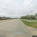 Man lying unresponsive on sidewalk in Lakewood Village