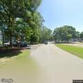 Officer checks white truck at golf course lot
