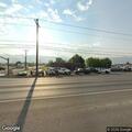 Officer conducts traffic stop on red truck