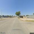 Reckless tan truck racing near intersection