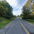 Leaning tree threatens power lines on Greylock Street