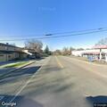 Person with leg pain at bus stop near San Benito and Vestal