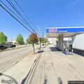 Traffic crash at gas station with police on scene