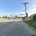 Semi truck spilling animal spray debris at stoplight