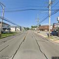 Suspicious occupied silver sedan at intersection