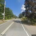 Car stuck on railroad tracks near Cohasset station