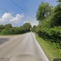 Small roadside fire near curve on Mason Hill Road