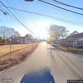 Officer conducts traffic stop on red Buick sedan