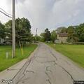 Report of sick raccoon in yard on North Dewey