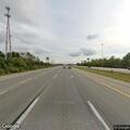 Disabled vehicle on I-71 shoulder with flat tire